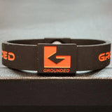 Grounded Energetic Wristband (Black/Orange) - Watch it! Pte Ltd